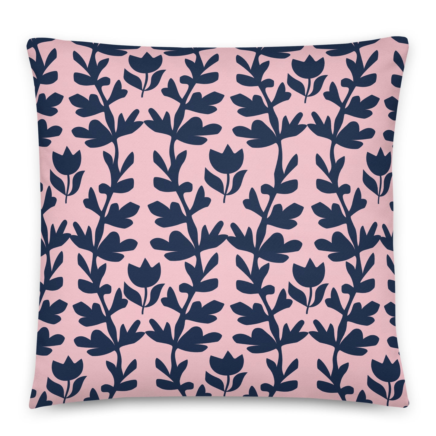 A square throw pillow featuring a repeating navy blue botanical vine pattern on a soft pink background.