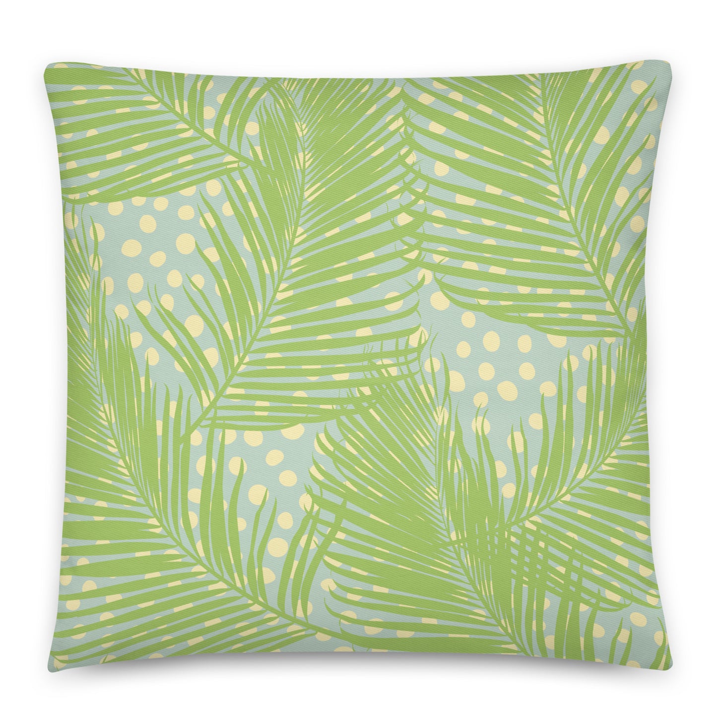 A square throw pillow featuring a tropical palm leaf pattern in shades of green over a light blue background with yellow polka dots.