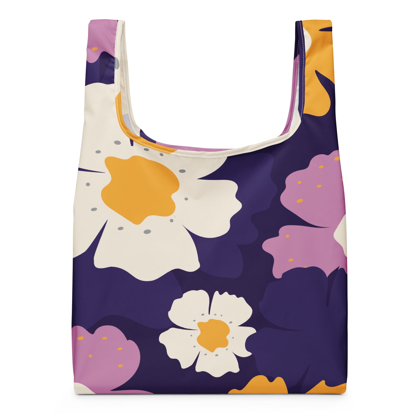 A reusable tote bag with a dark purple background and a bold floral pattern featuring white, lavender, and orange flowers.
