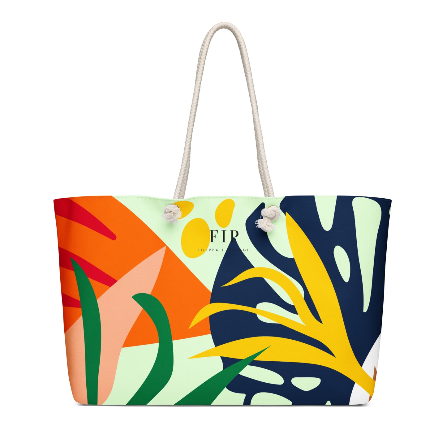 A tote bag with a colorful abstract tropical leaf print and white rope handles.