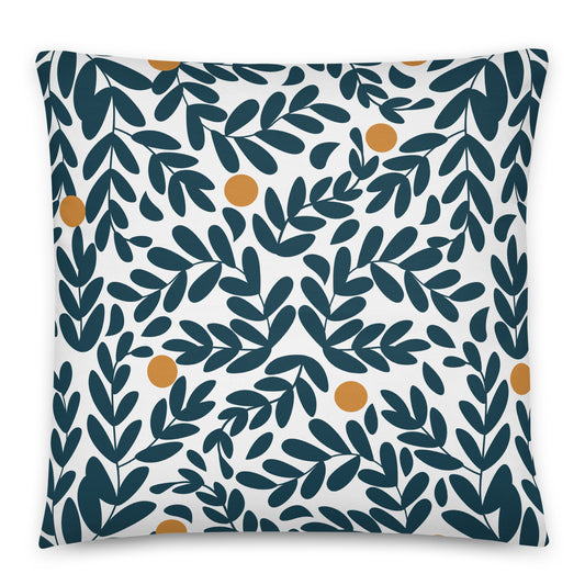 A square throw pillow featuring a repeating pattern of dark teal leaves and small mustard-yellow olives. 