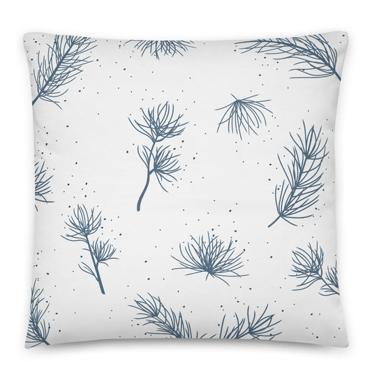 A square throw pillow with a white background and a repeating pattern of blue pine branches and small scattered dots.
