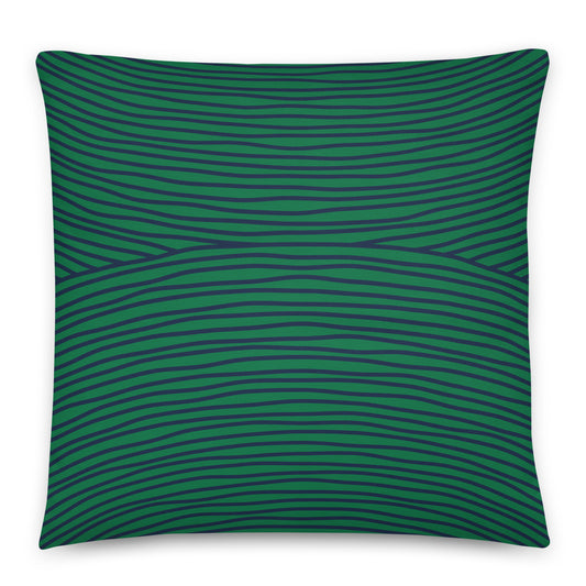 A square throw pillow featuring a dark green and navy blue wavy horizontal stripe pattern. 
