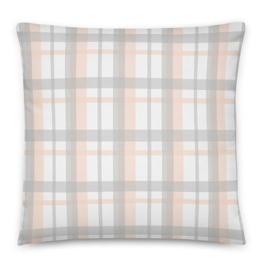 A square throw pillow featuring a soft plaid pattern with intersecting stripes of light gray, dusty peach, and white. 