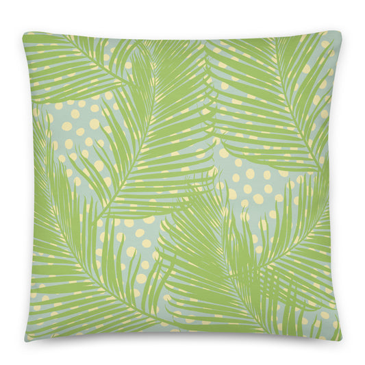 A square throw pillow featuring a tropical palm leaf pattern in shades of green over a light blue background with yellow polka dots.