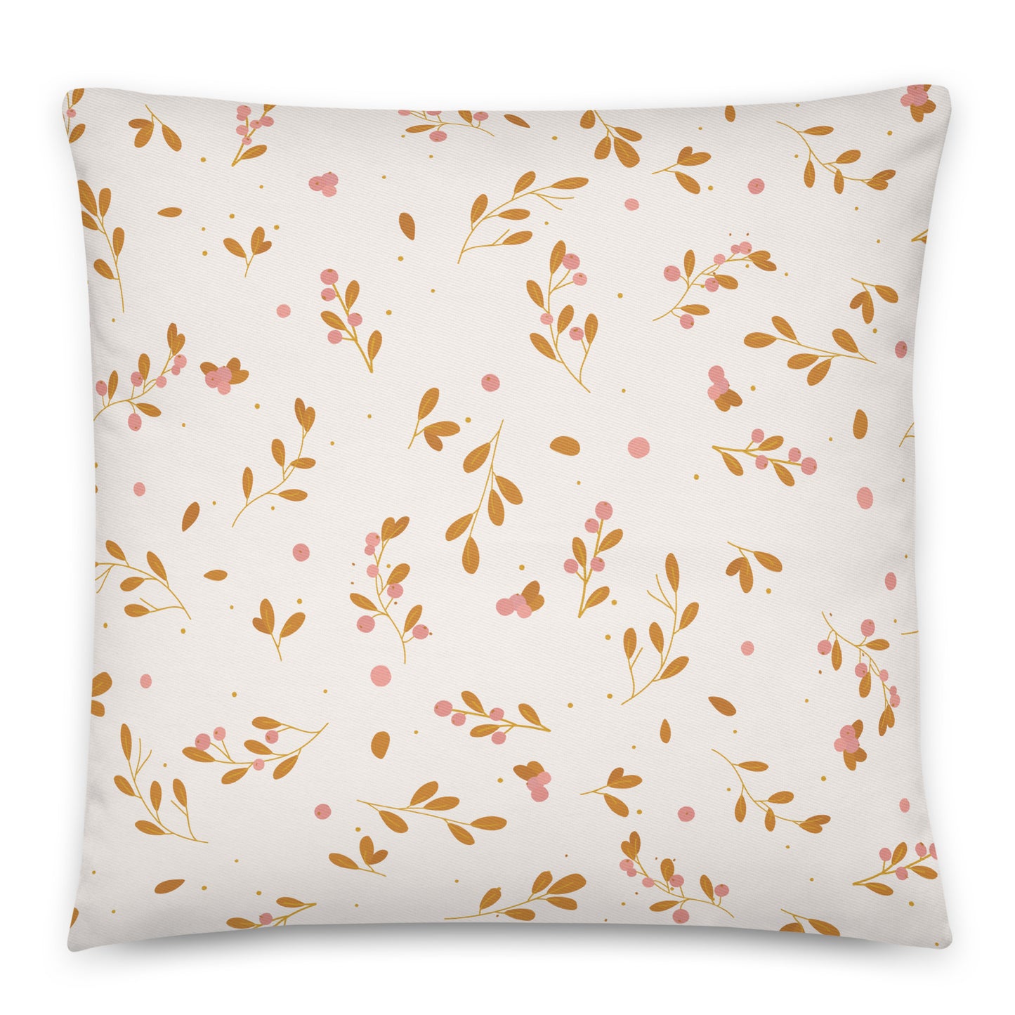 A square throw pillow featuring a delicate botanical pattern of gold-brown leaves, pink berries, and small gold dots on a warm off-white background.