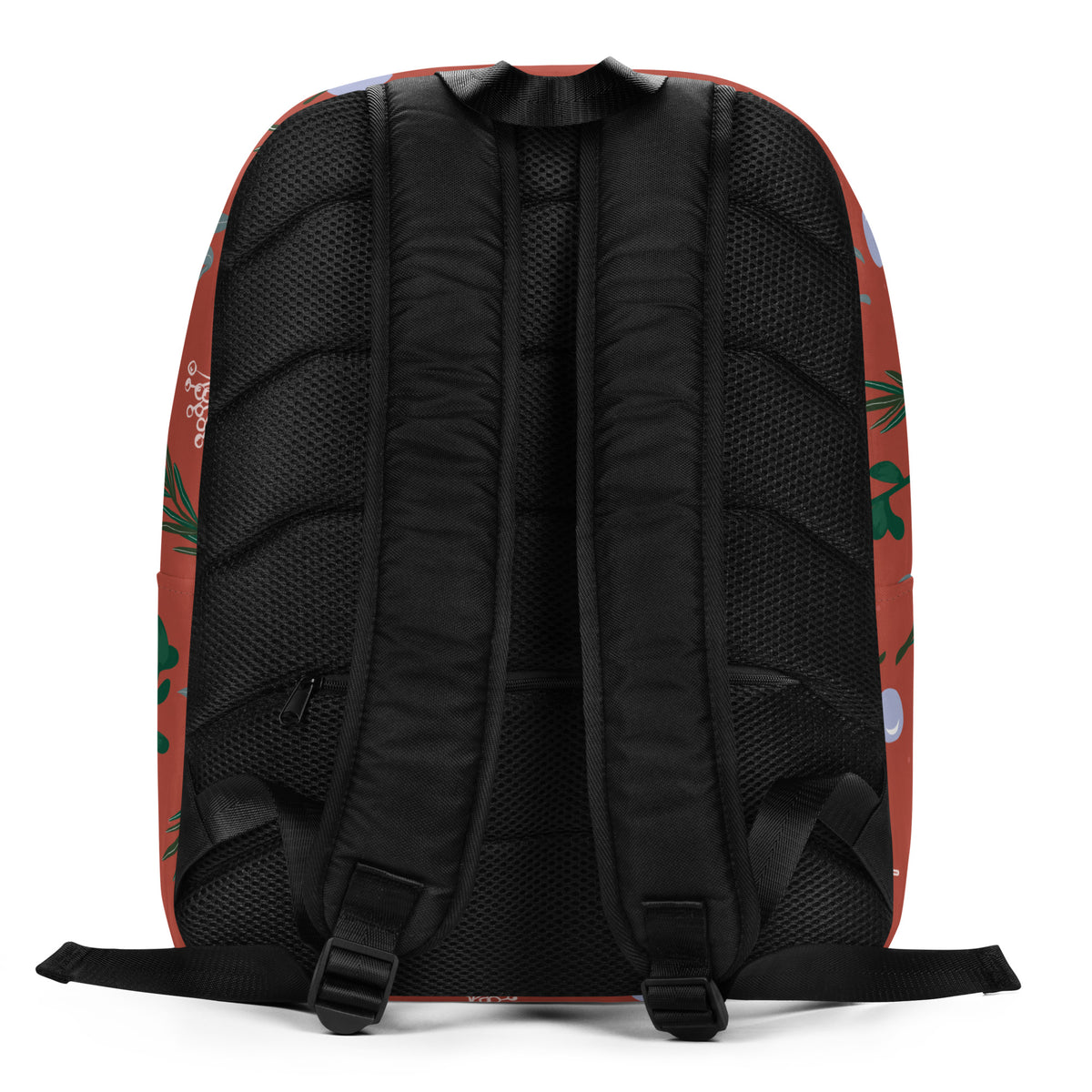 The back view of a backpack with a black mesh and padded backrest, featuring a terracotta red side panel with a green leaf pattern 