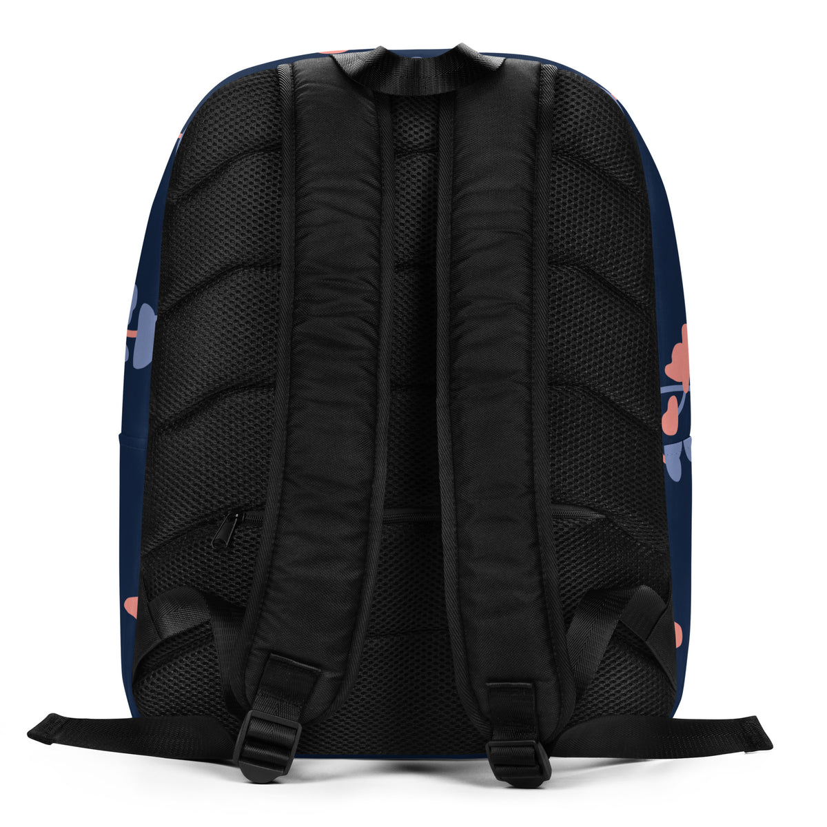 The back view of a navy blue backpack with black padded mesh back straps and small pink and blue graphic accents on the sides