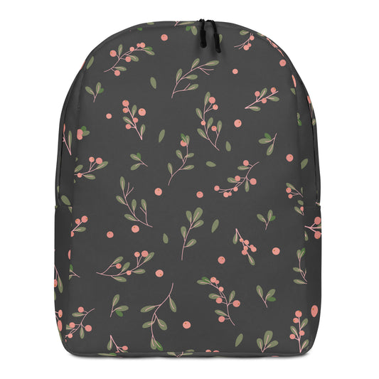 A dark gray backpack featuring an all-over botanical pattern of pink berries and green leaves