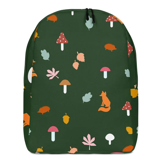 Green backpack with a nature-themed pattern featuring mushrooms, leaves, and a fox.