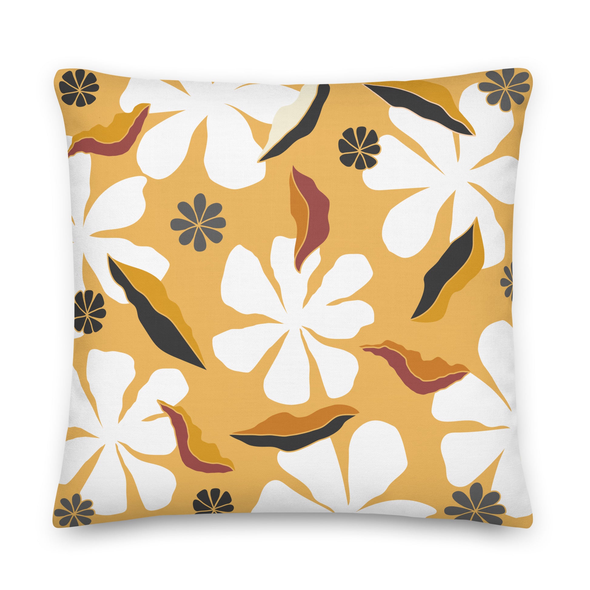 A square throw pillow featuring a retro floral pattern with large white flowers, mustard yellow background, and abstract black and rust-brown leaf shapes.
