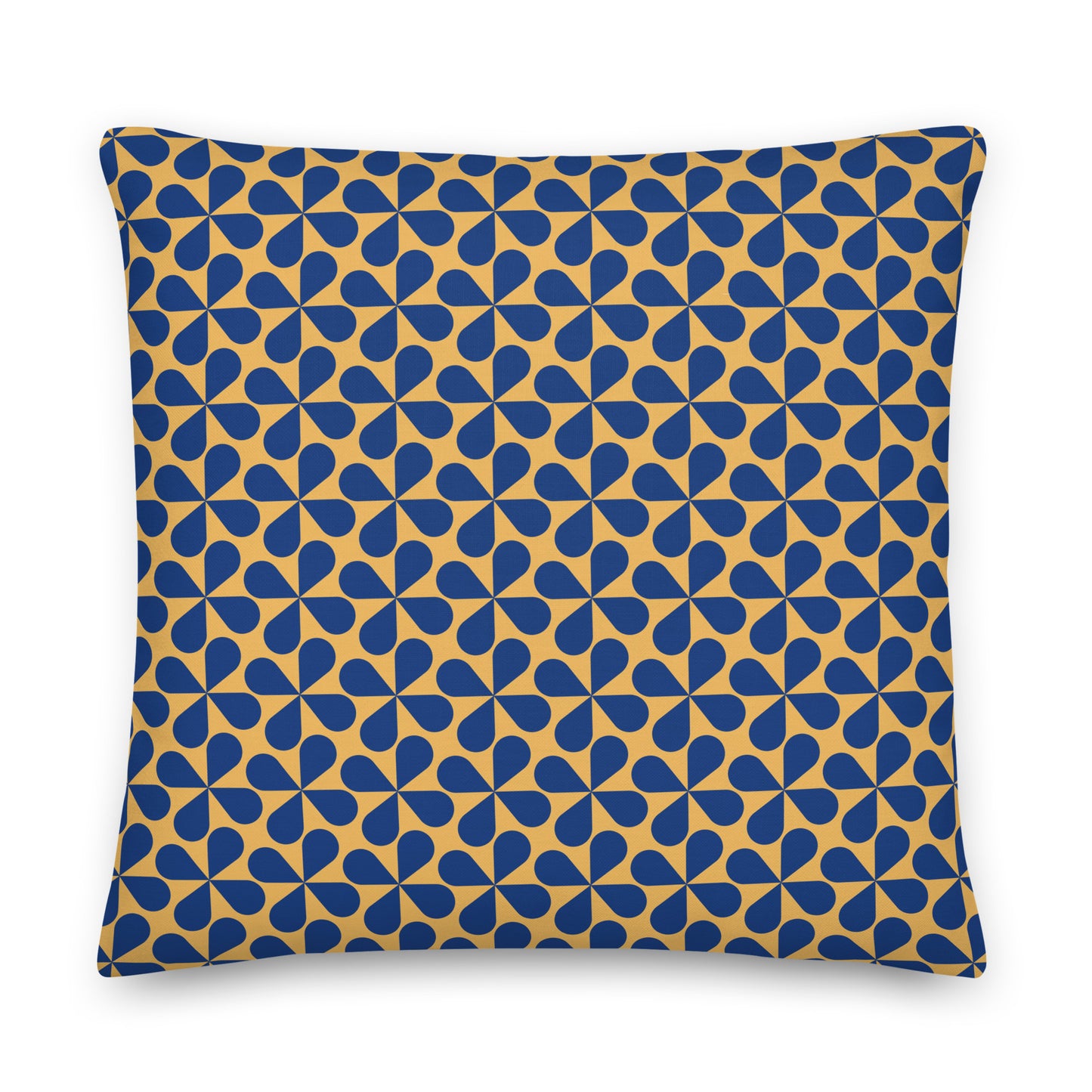 A square throw pillow featuring a repeating geometric pattern of blue teardrop shapes on a mustard yellow background