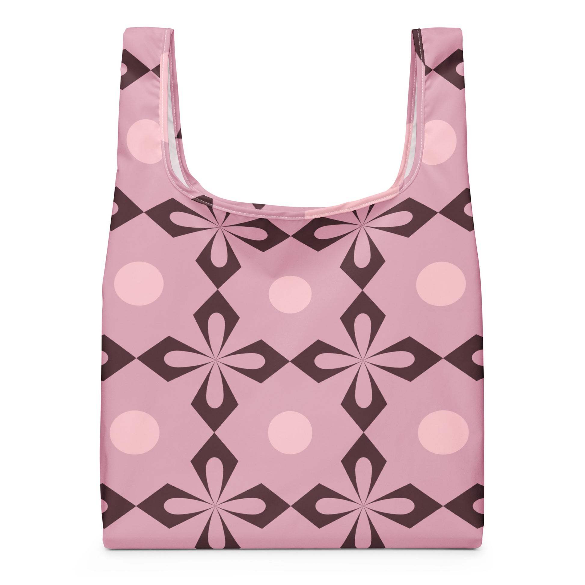 A reusable shopping bag with a retro geometric pattern in pink, light pink, and dark brown.