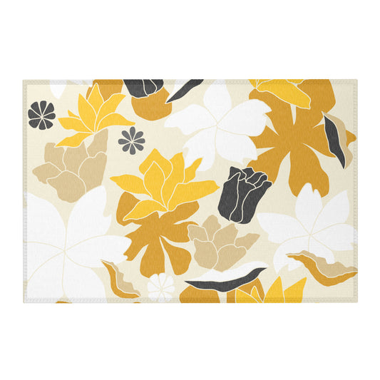 A rectangular area rug with a modern floral pattern in mustard yellow, beige, white, and charcoal gray on a cream background.