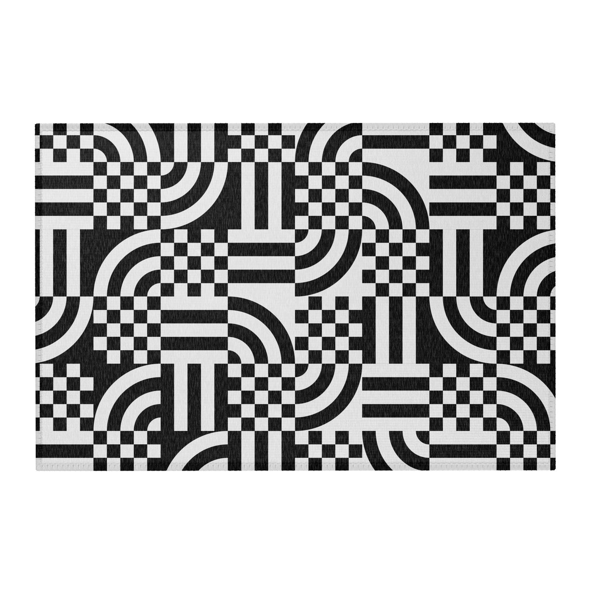 A rectangular area rug with a bold black and white geometric pattern of checkered squares, arches, and stripes,