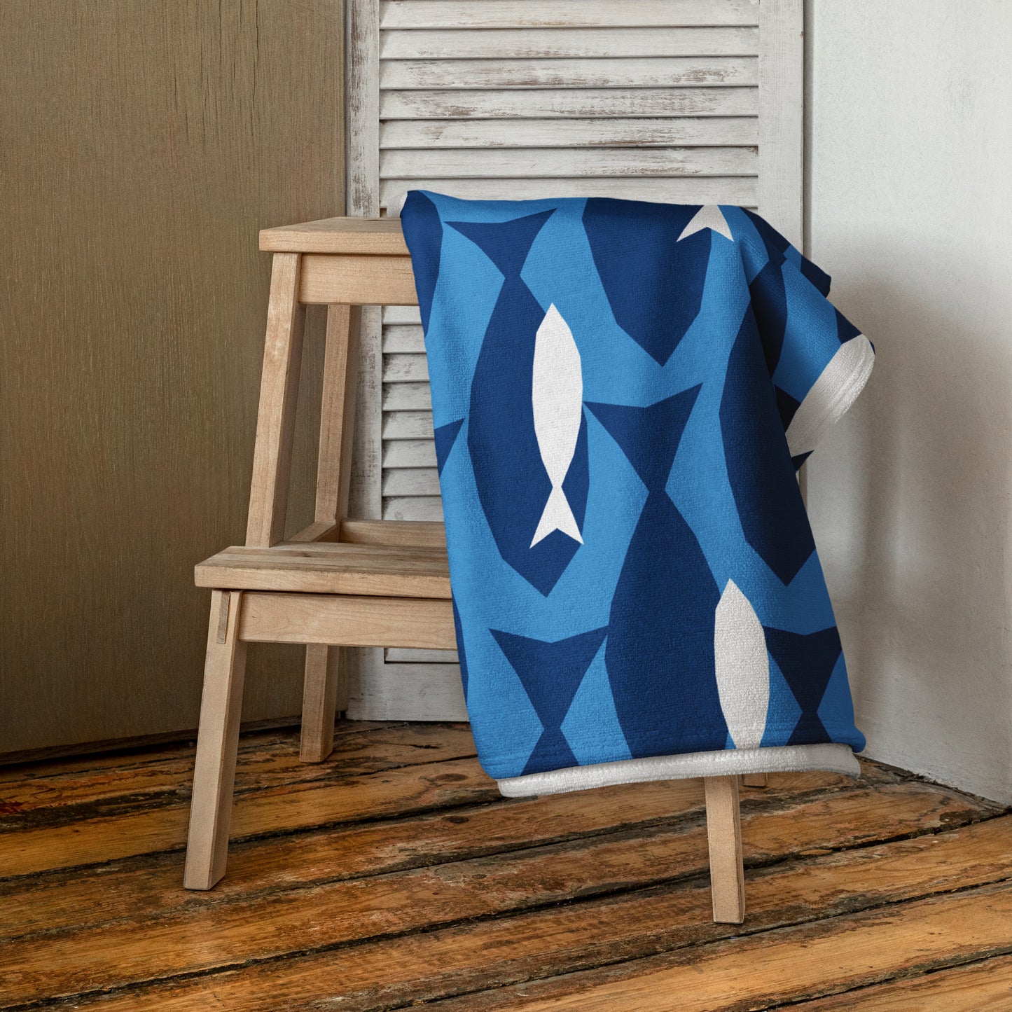 Blue & white patterned beach towel with fish coastal.