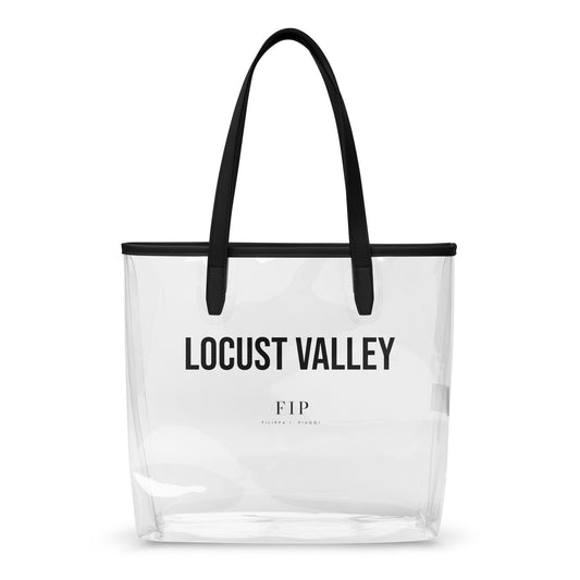 A clear plastic beach tote bag with black handles and black trim, featuring the text LOCUST VALLEY