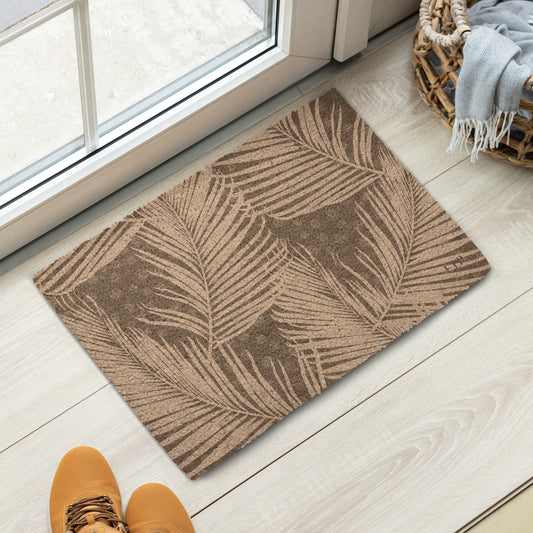 A rectangular entryway mat with a brown and beige palm leaf pattern. 