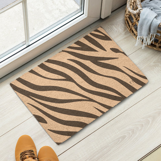 A rectangular coir doormat with a brown zebra stripe pattern. 