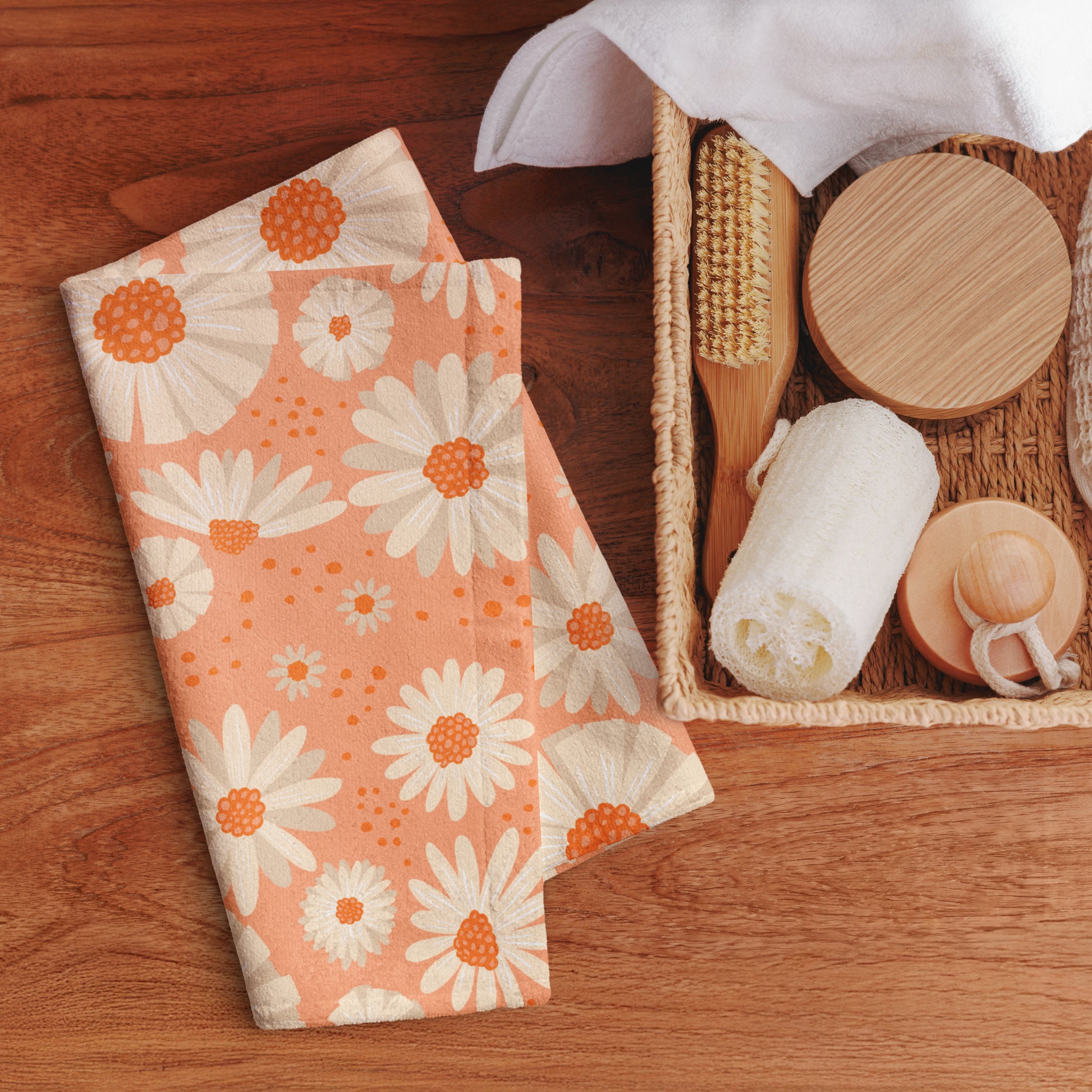 Hand towel with a white daisy floral pattern.