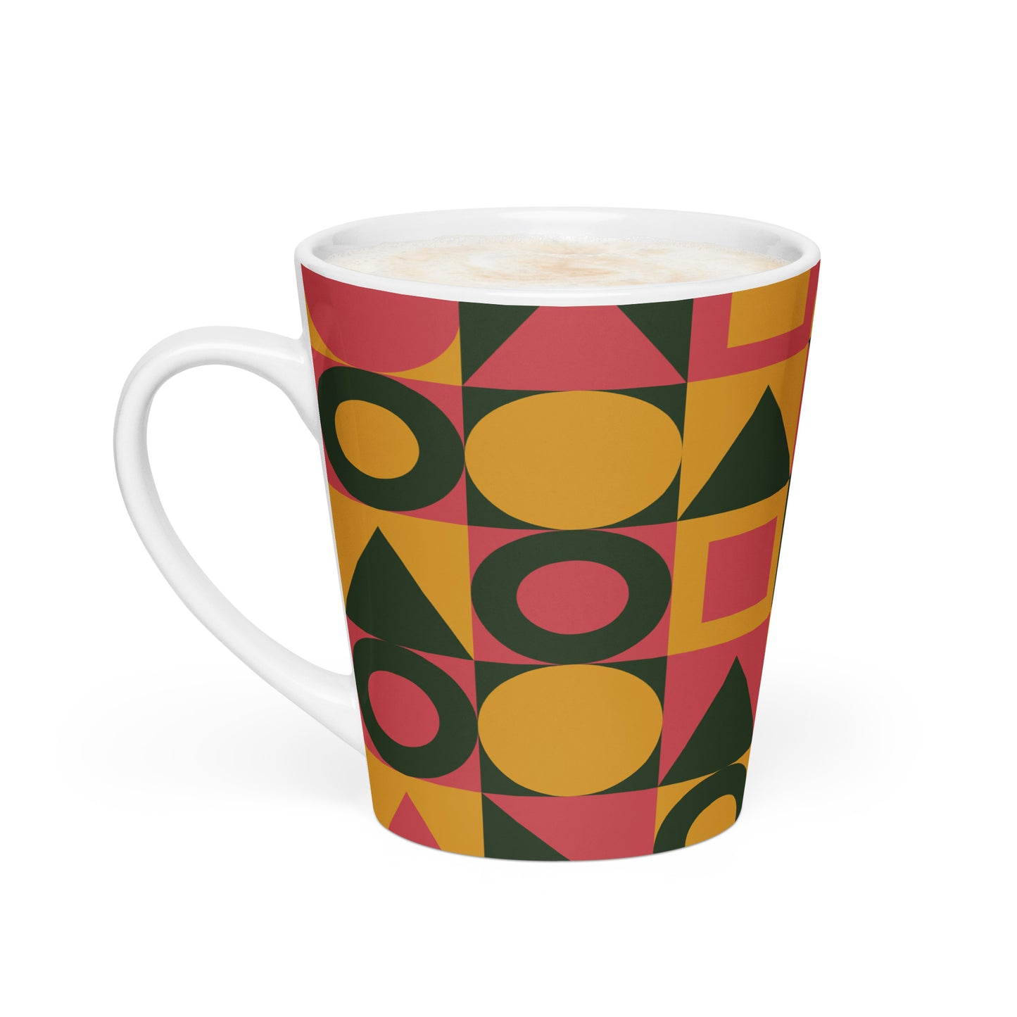 A white ceramic mug with a colorful geometric pattern of yellow, pink, and dark green shapes. 