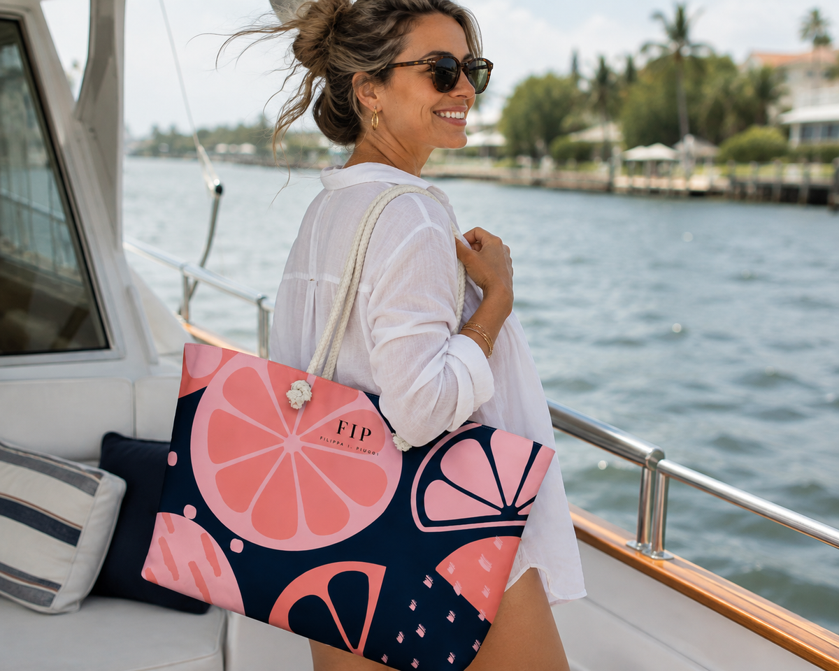 large tote bag with a pink and navy citrus slice pattern. 