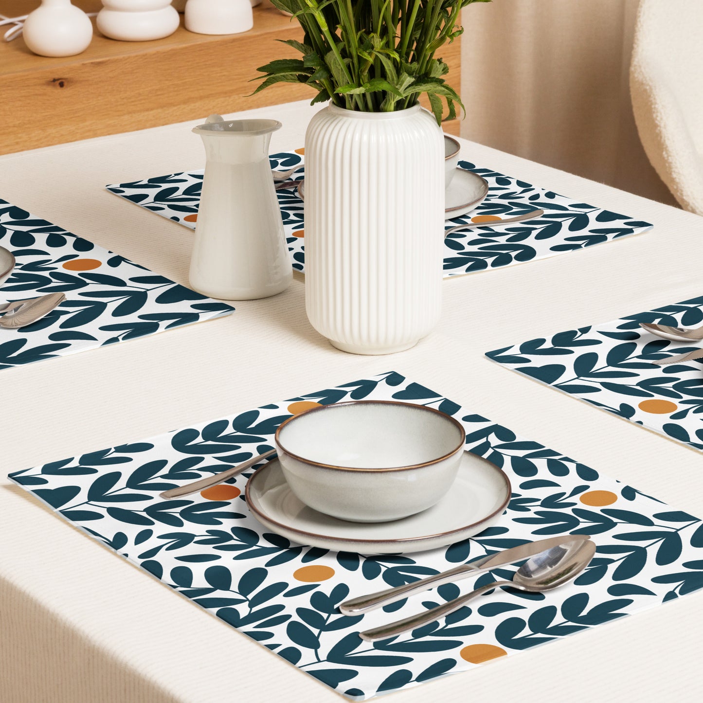 Blue and yellow olive leaf-patterned placemats. 