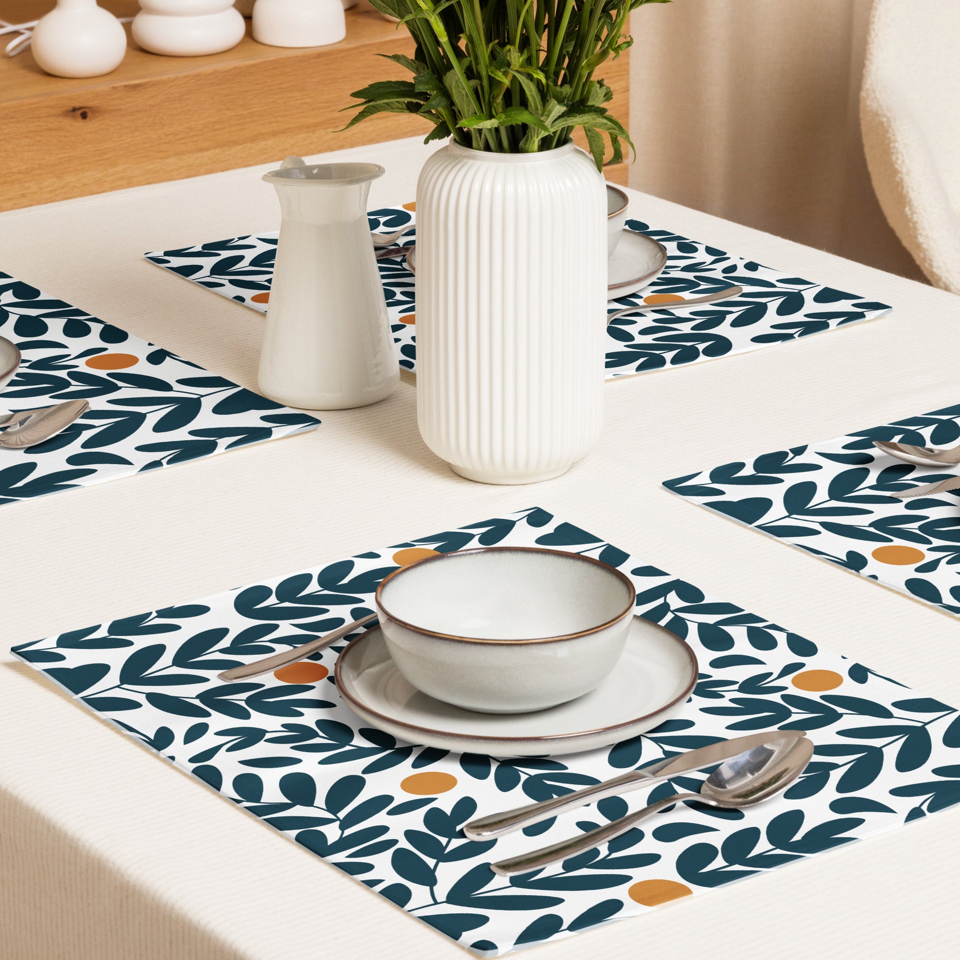 Blue and yellow olive leaf-patterned placemats. 
