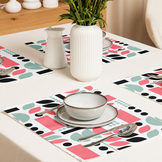 geometric pattern of pink, mint green, black, and white shapes. 