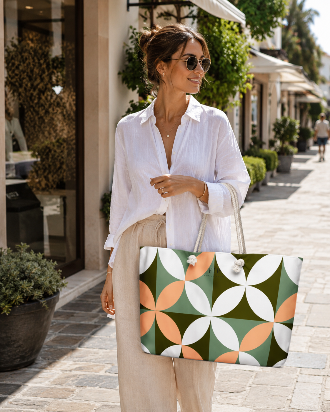  large tote bag with a retro geometric pattern of green, orange, and white overlapping circles.