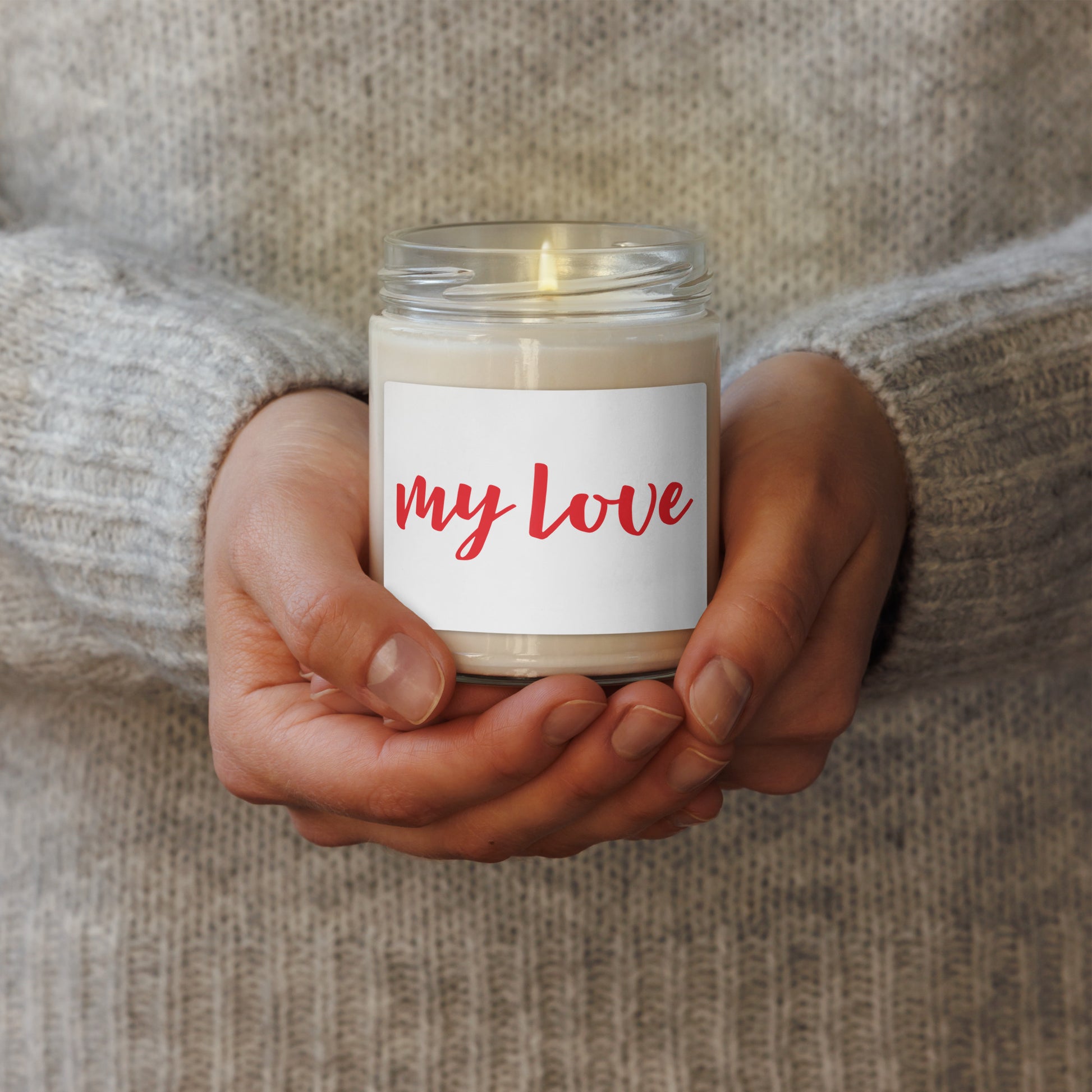The candle has a white label with the words 'my love' written in red script.