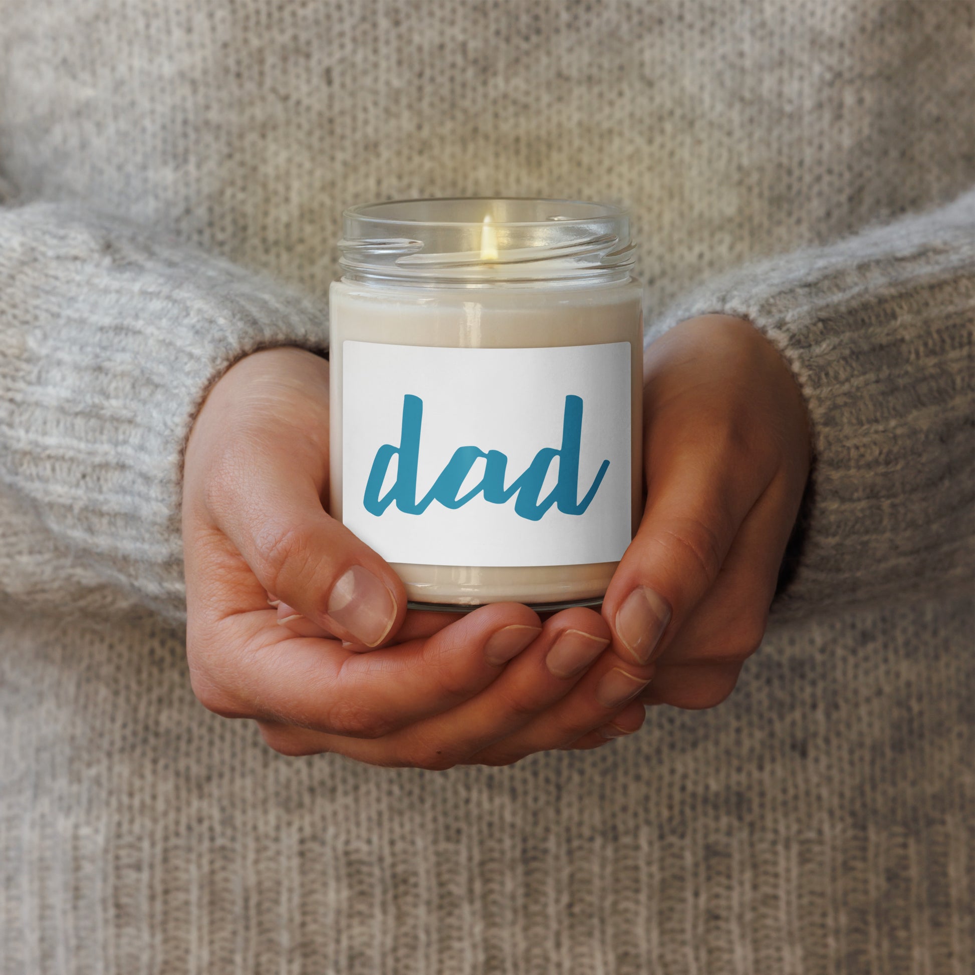 soy scented candle with dad text in blue