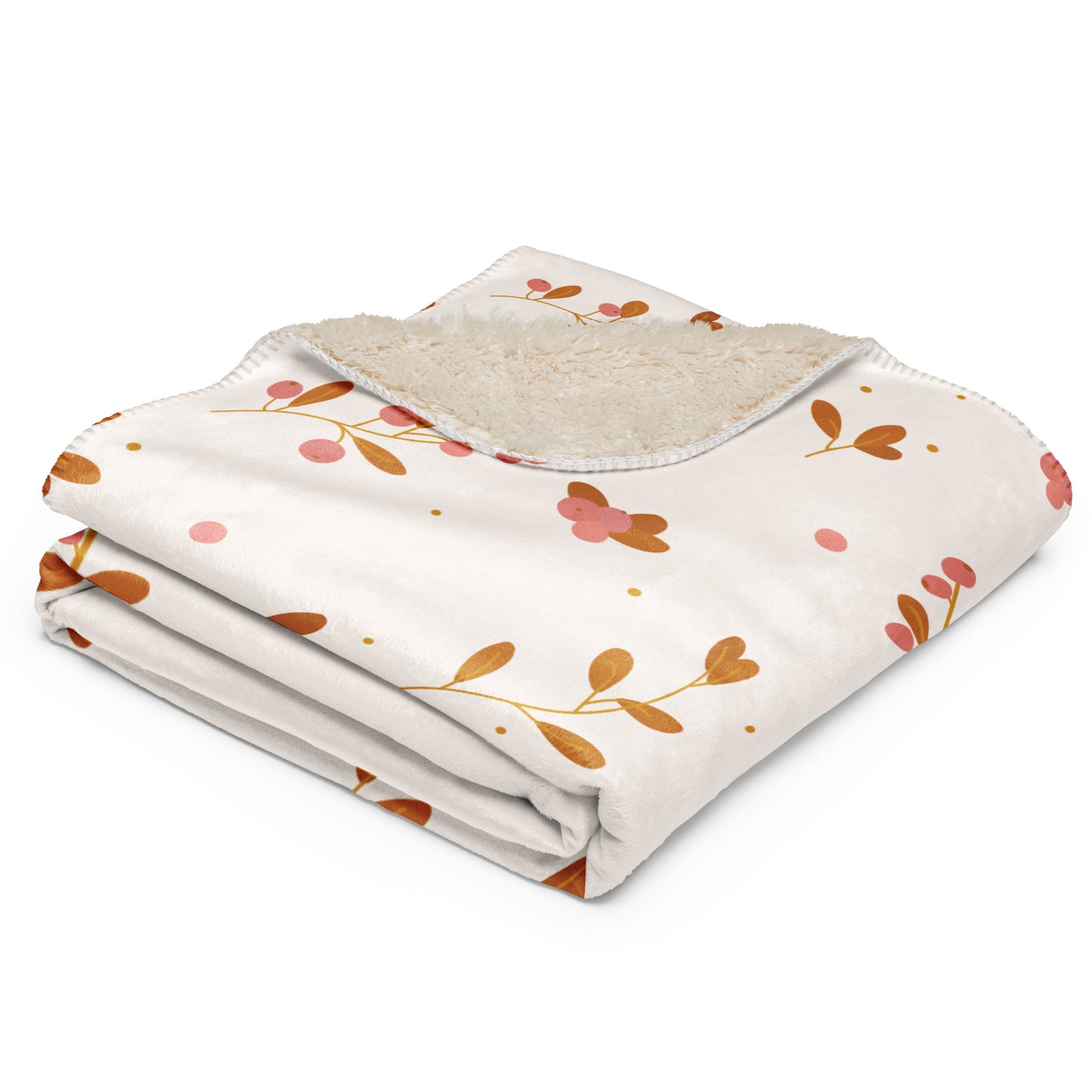  Blanket with a cream-colored base, decorated with a pattern of orange-brown leaves, pink flowers, and small pink dots, featuring a soft beige sherpa lining on the reverse side.