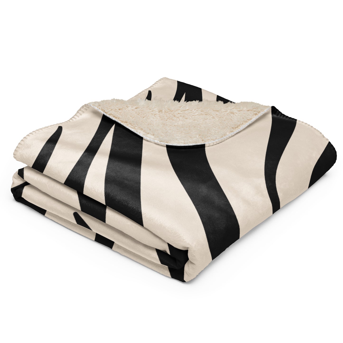 Cream zebra stripe pattern on the exterior and a soft cream sherpa lining on the reverse.