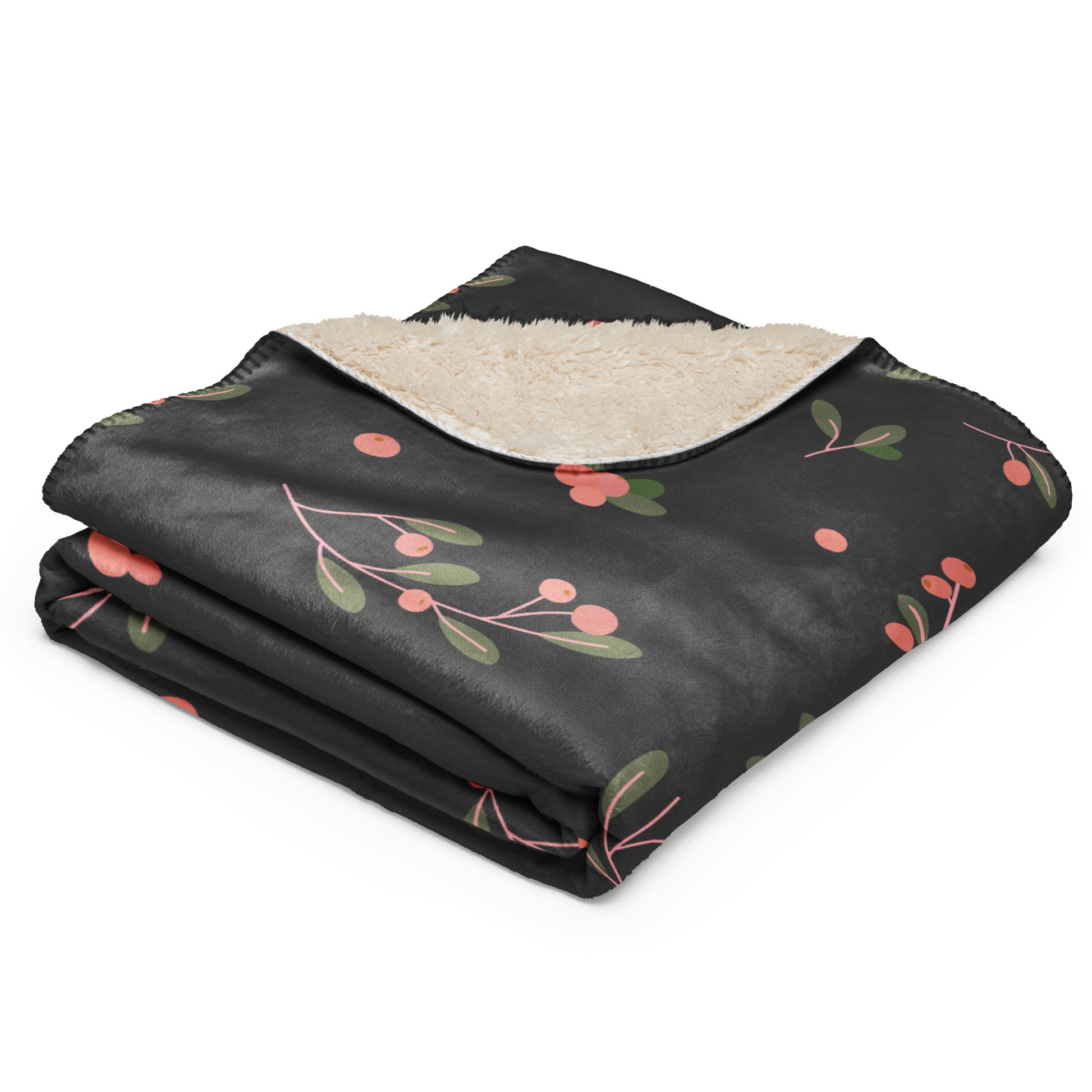 Folded floral-patterned blanket with a beige interior. 
