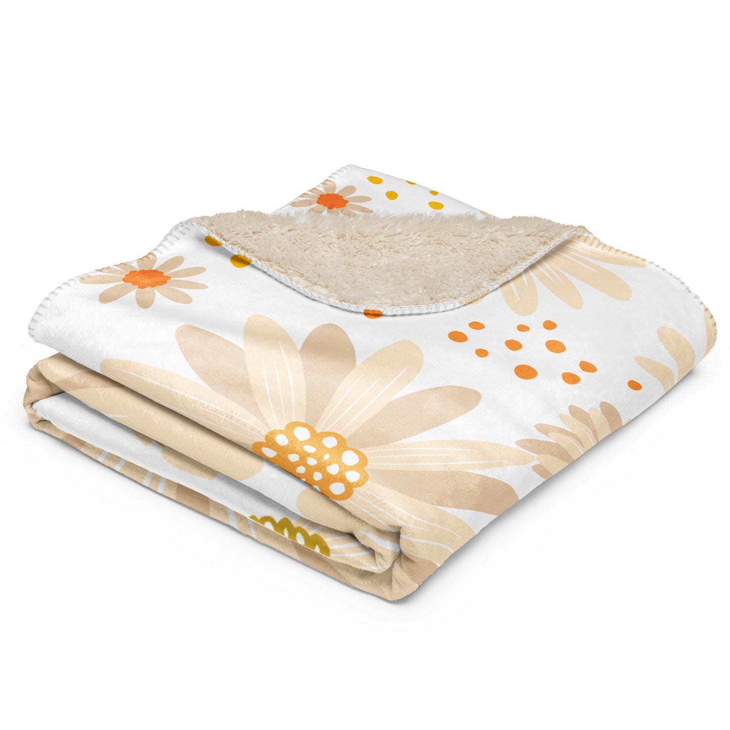 Floral-patterned sherpa blanket with beige flowers and orange. 