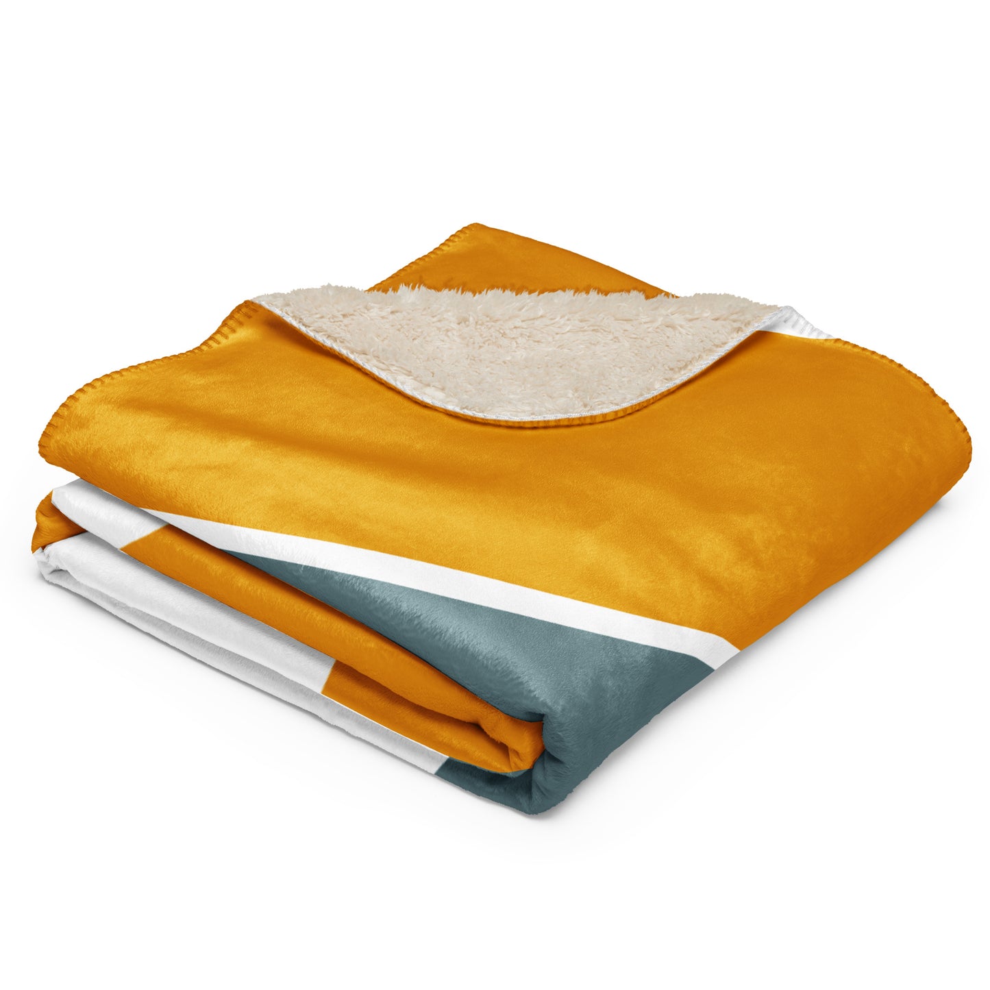 Throw blanket with a mustard yellow sherpa-lined exterior and a color-blocked design featuring white and slate blue sections 