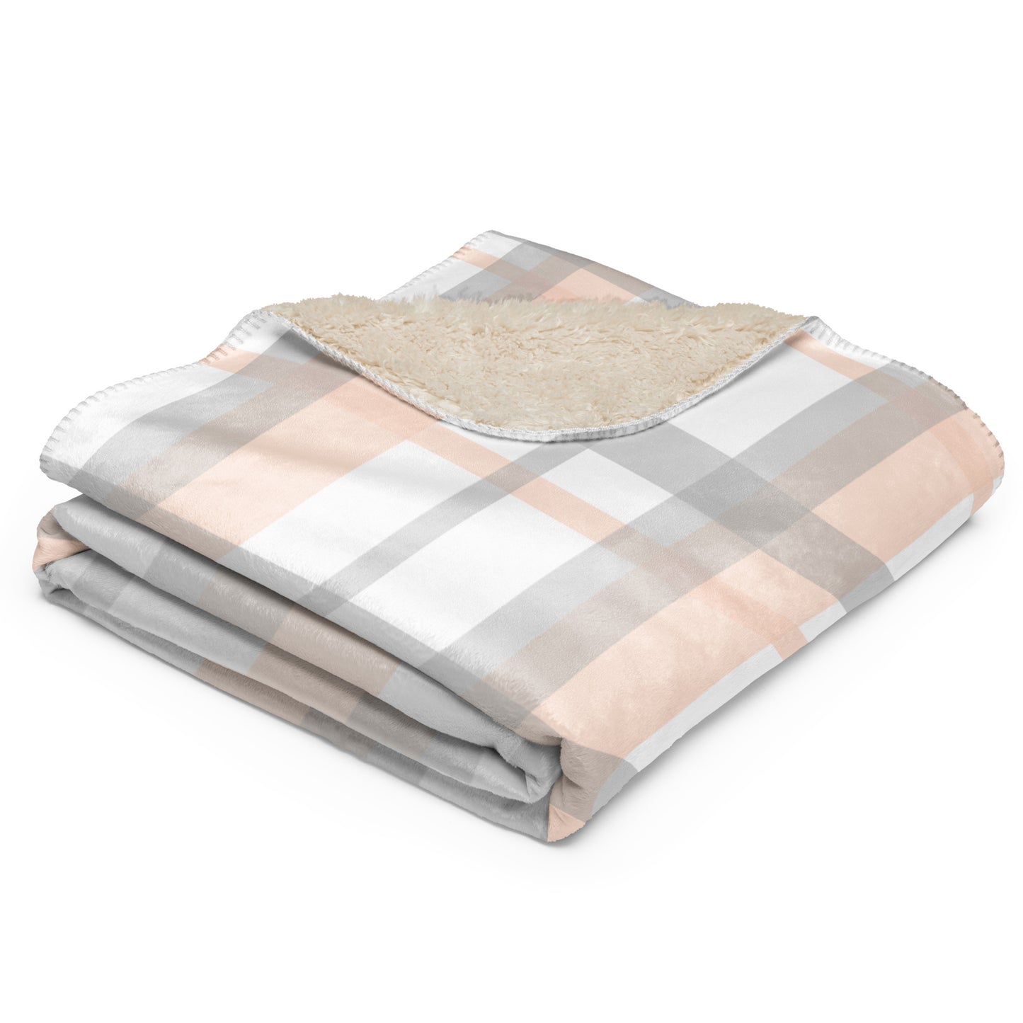 plaid blanket with a soft fleece sherpa lining, featuring a checkered pattern in dusty pink, gray, and white.