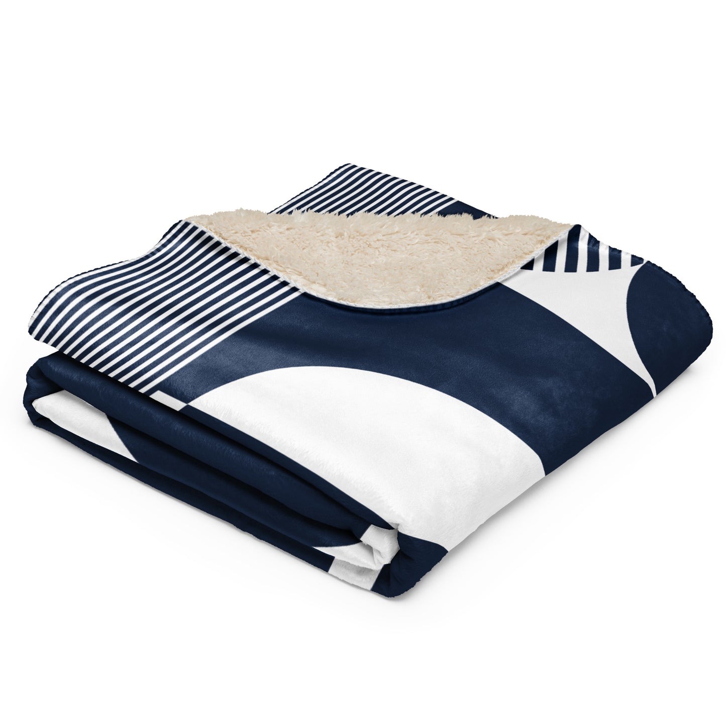 a navy blue and white geometric pattern, a navy and white striped section, and a beige sherpa lining