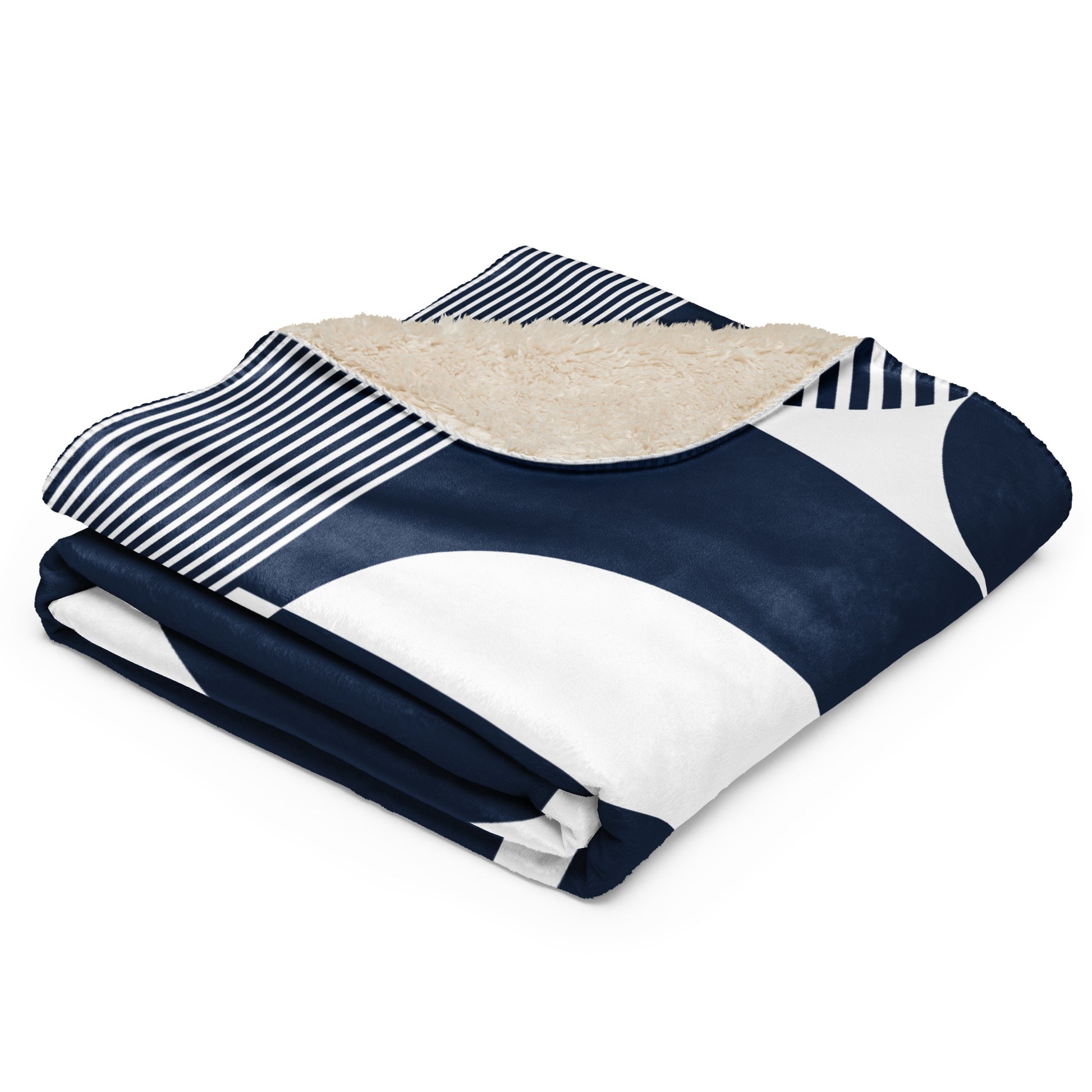 a navy blue and white geometric pattern, a navy and white striped section, and a beige sherpa lining