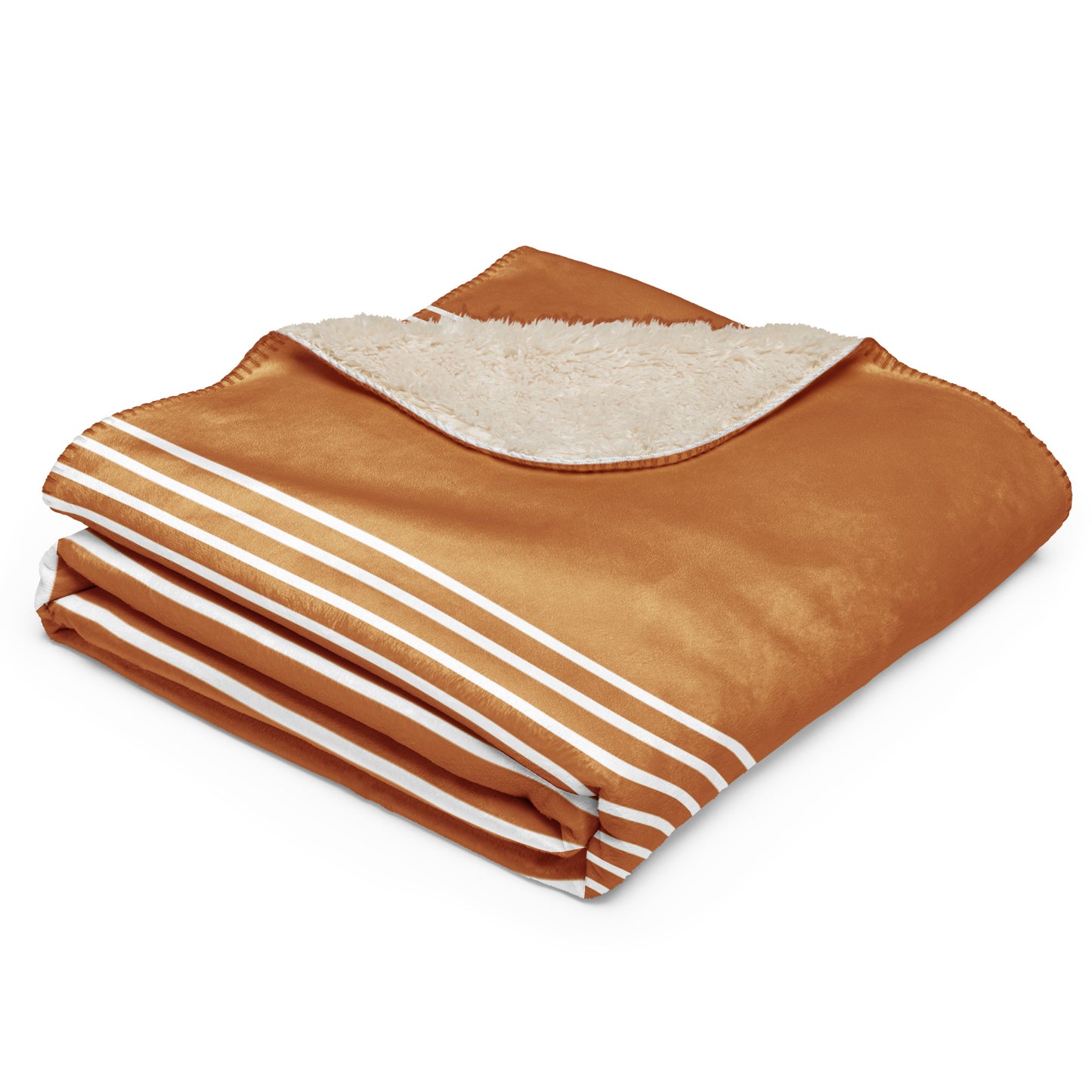A folded throw blanket with a warm brown satin-like exterior, white stripes along the edge, and a soft cream sherpa lining