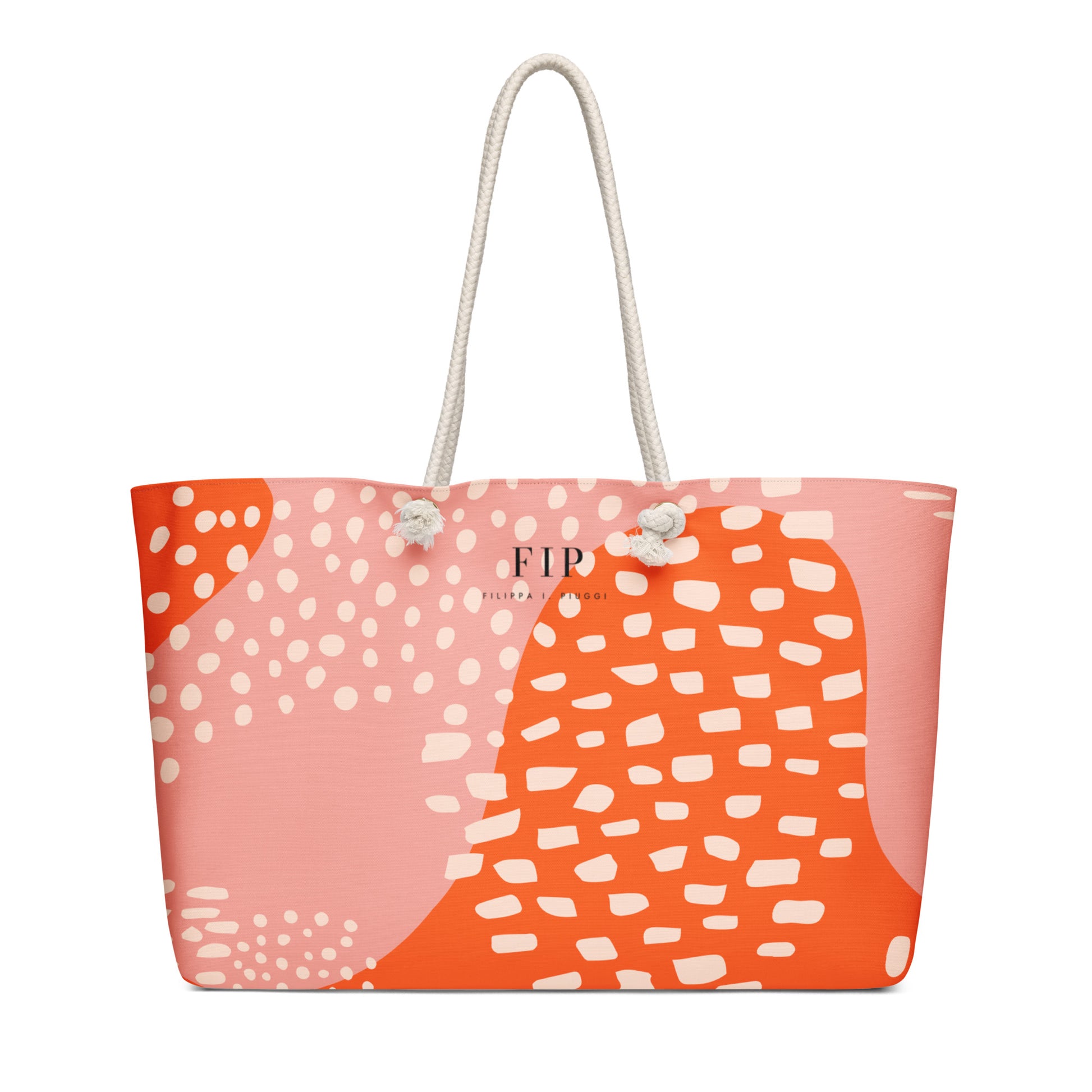 A tote bag with an abstract orange and pink pattern, featuring white rope handles. 