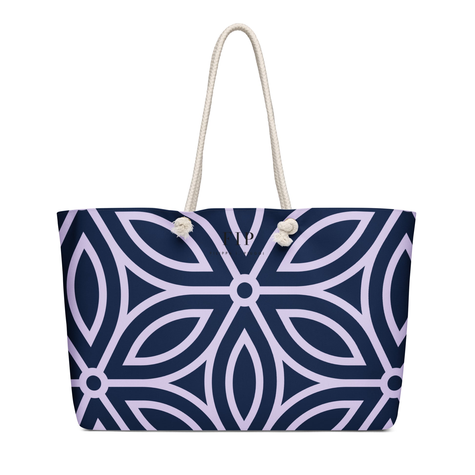 A tote bag with a navy blue and light purple geometric pattern, featuring thick off-white rope handles.