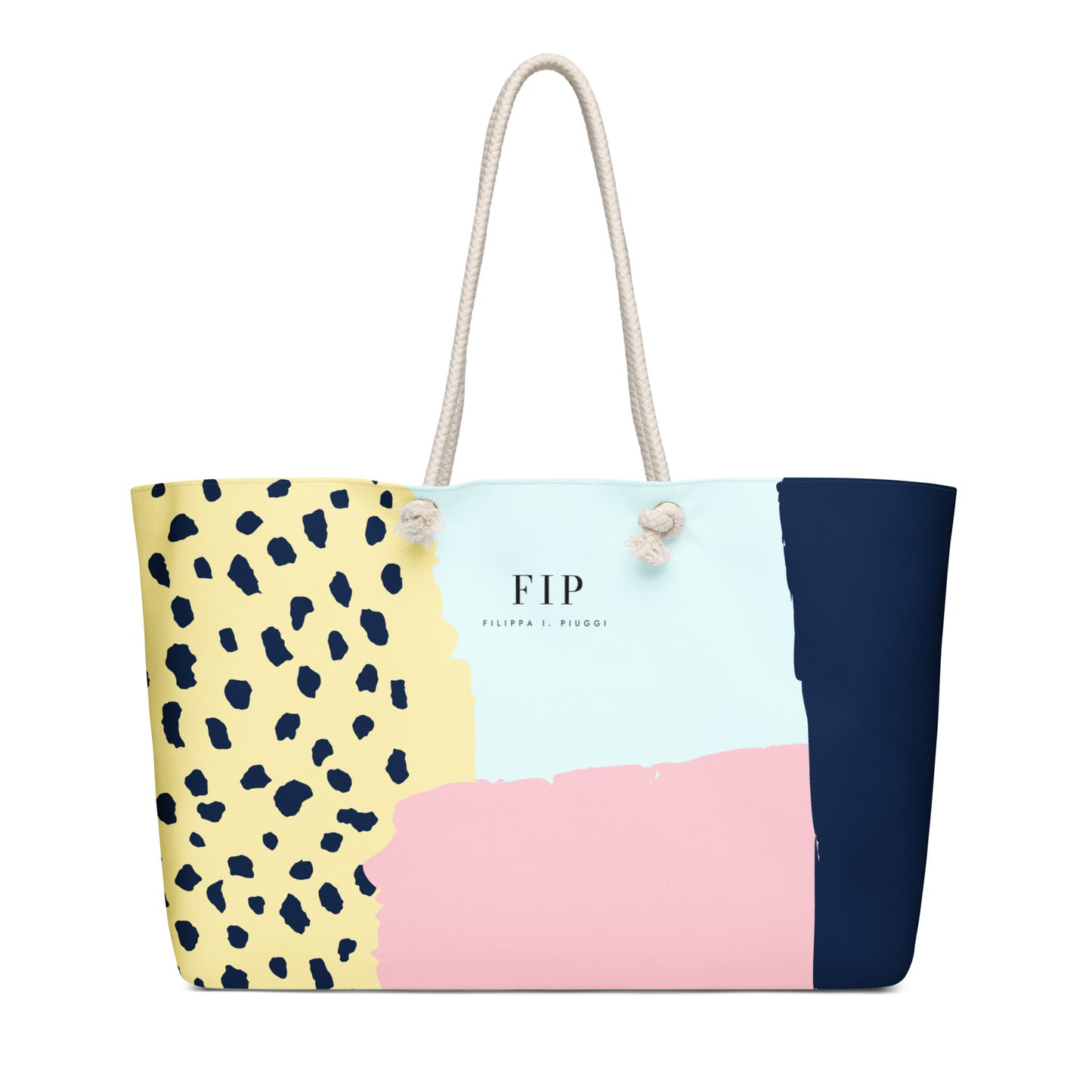 A rectangular tote bag with a color-blocked pattern featuring navy blue, light blue, pink, and yellow sections, including a navy leopard print on the left. 