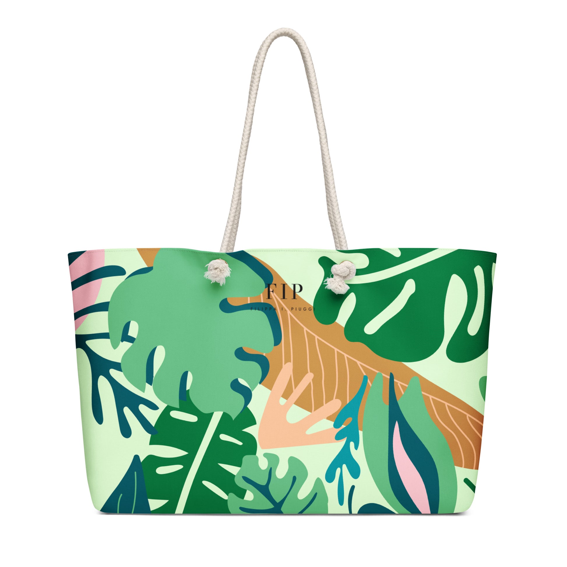 A tote bag with a tropical leaf print in shades of green, beige, pink, and blue, featuring cream-colored rope handles. 