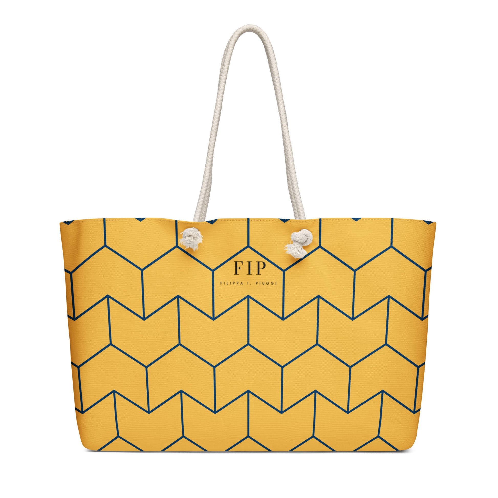 A yellow tote bag with a navy blue geometric cube pattern, featuring two white rope handles. 