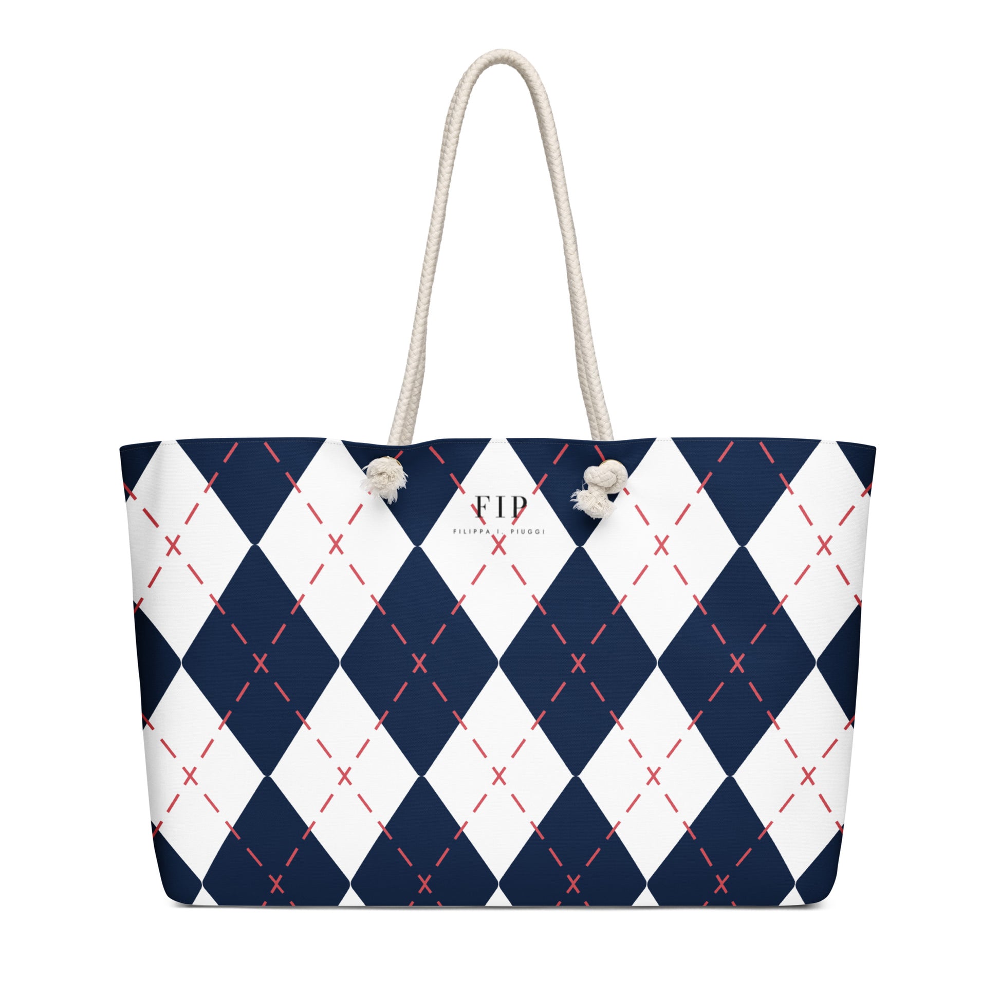 A tote bag with a navy blue and white argyle pattern, accented with thin red dashed lines and featuring off-white rope handles.