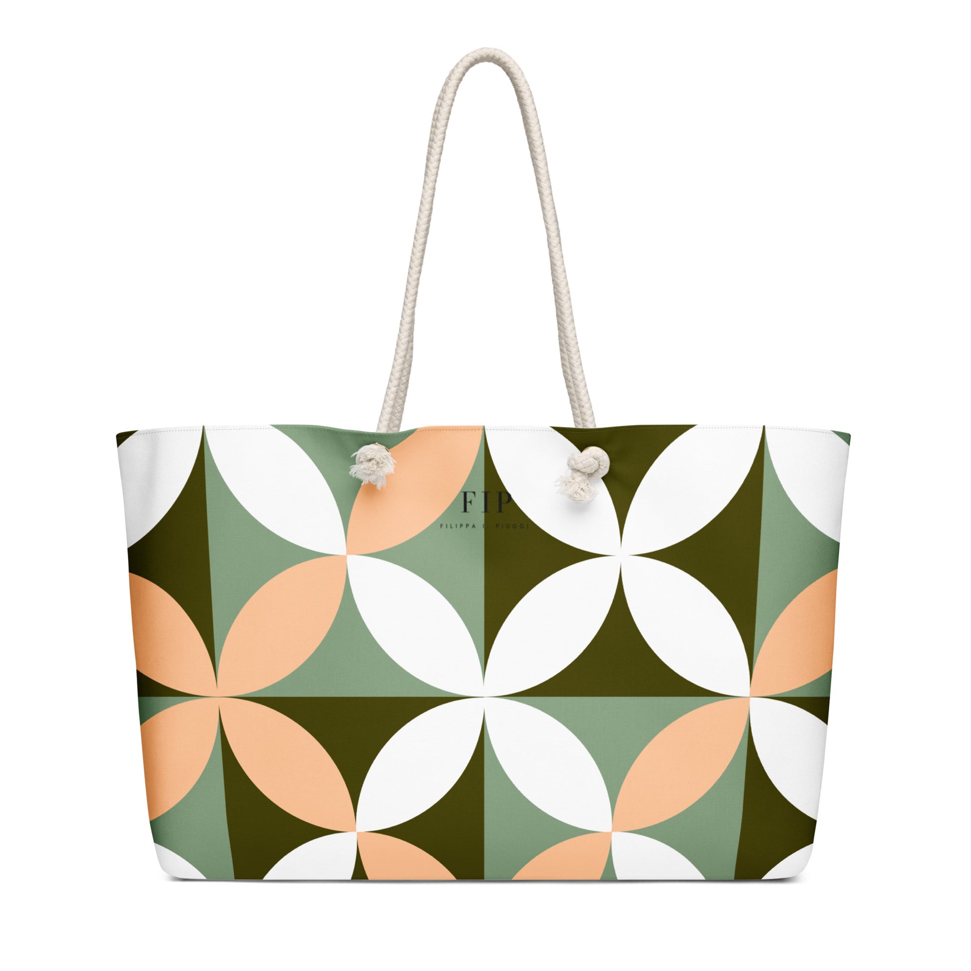A tote bag with a geometric pattern of interlocking white, sage green, olive green, and peach petal shapes, featuring off-white rope handles 