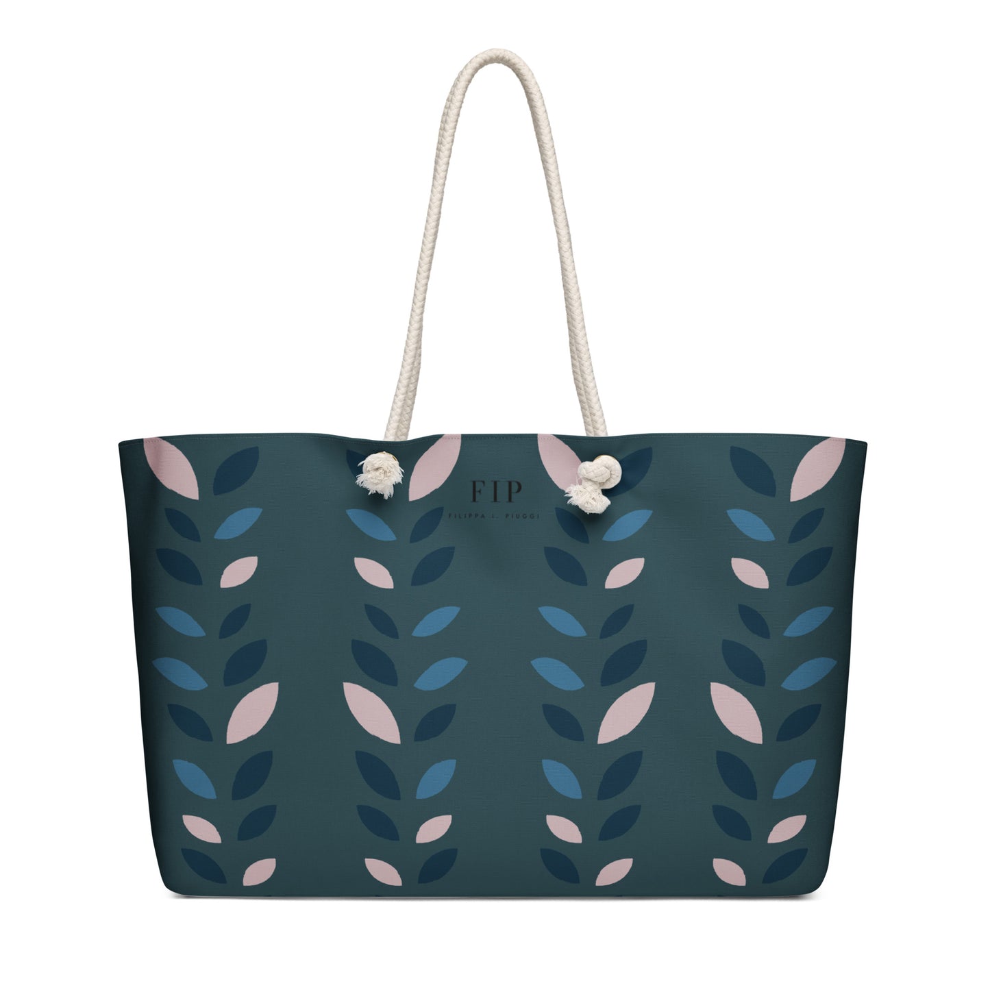 A dark teal tote bag with a vertical pattern of blue and pink leaves, featuring cream rope handles 