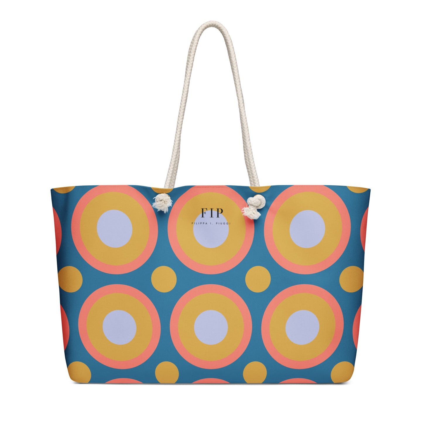 A tote bag with a retro concentric circle pattern in blue, yellow, pink, and white, featuring white rope handles 